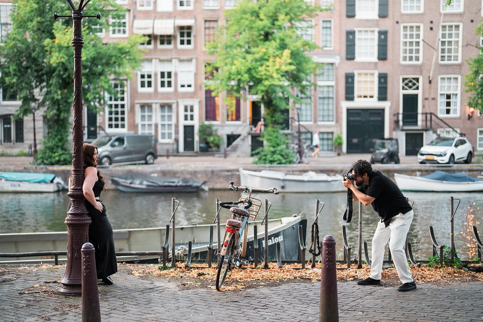 Couple walking an Amsterdam street at golden hour