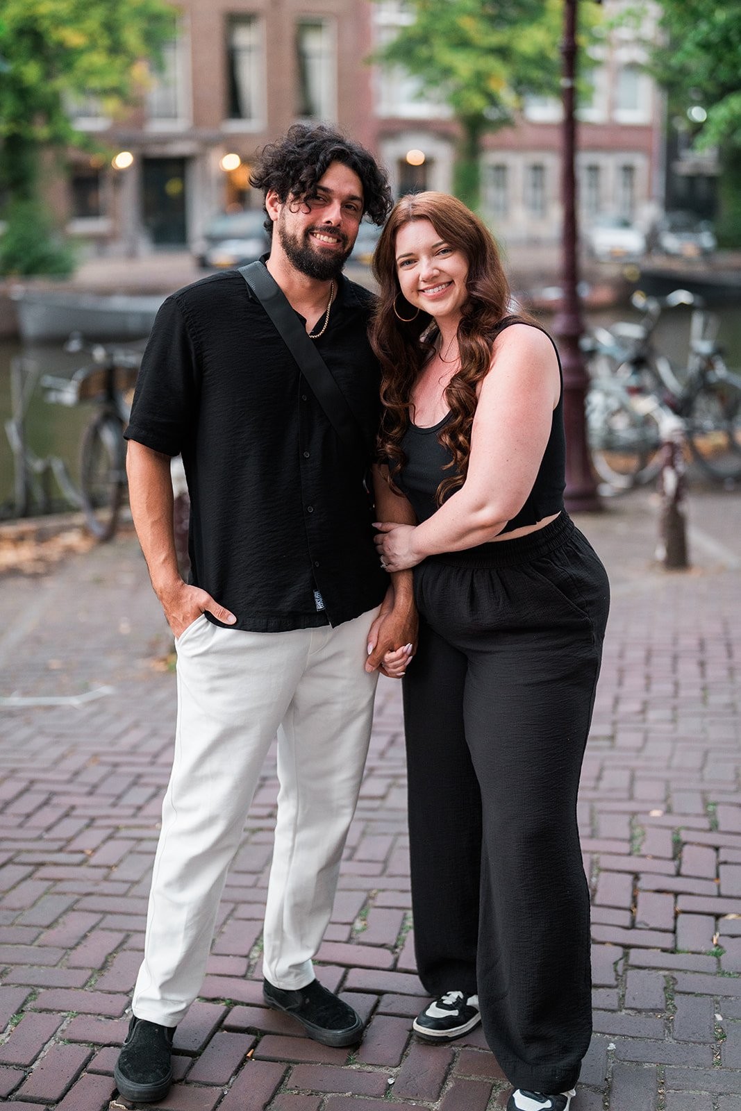 Couple portrait on the Keizersgracht canal at sunset