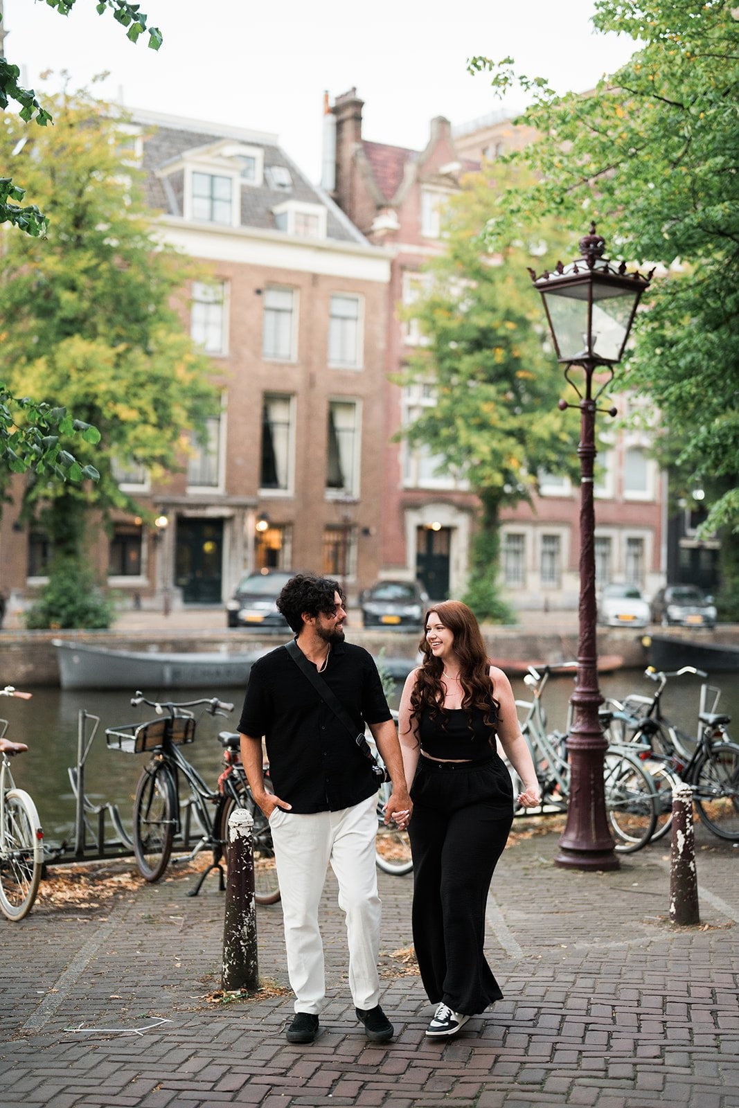 Suzie and Carlos sharing a candid laugh in Amsterdam