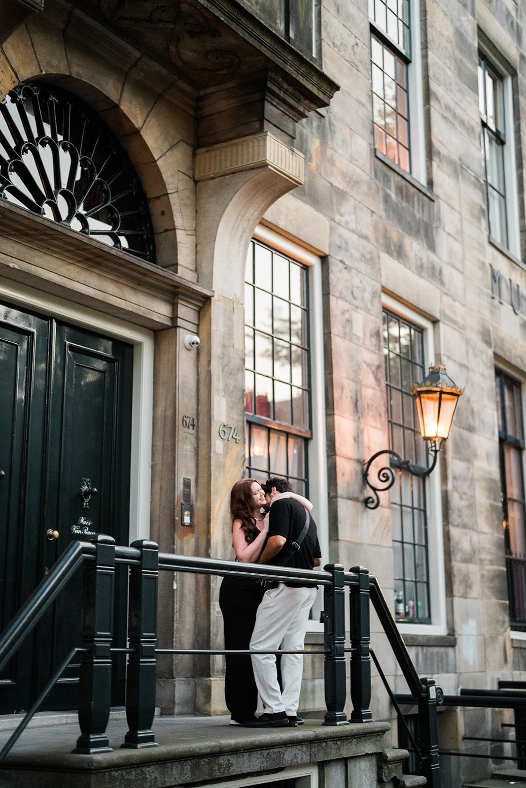 Soft-light couple portrait beside an Amsterdam canal