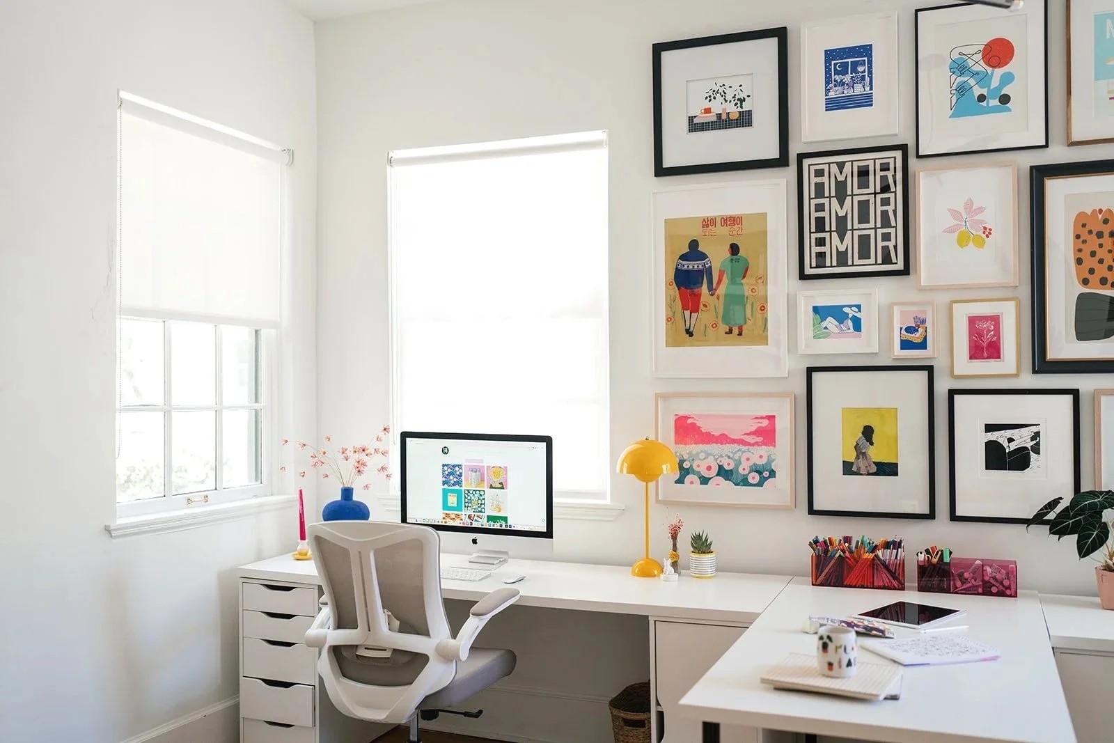Bright home office with white desk and ergonomic chair